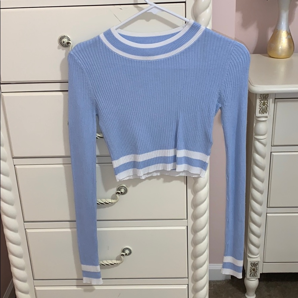 Tight light blue shirt w/ white details